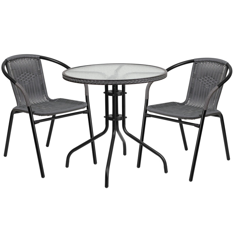 28'' Round Glass Metal Table with Gray Rattan Edging and 2 Gray Rattan Stack Chairs