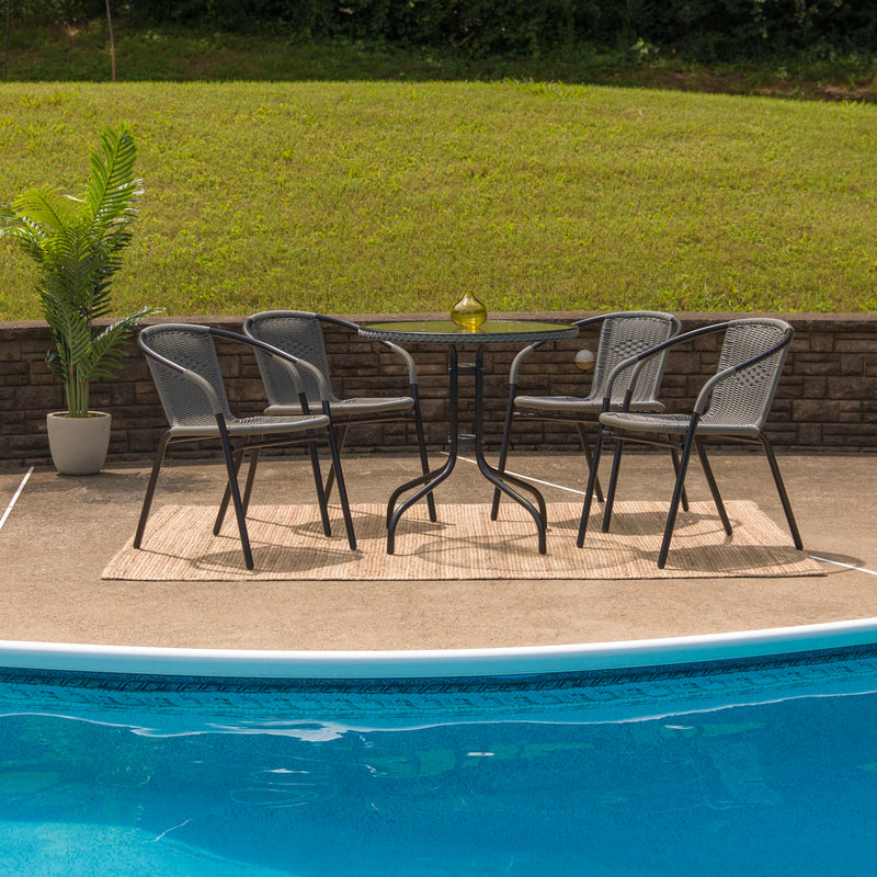 28'' Round Glass Metal Table with Gray Rattan Edging and 4 Gray Rattan Stack Chairs